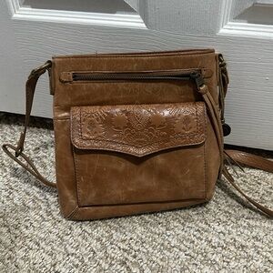Classic crossbody purse with beautiful embossed floral pattern